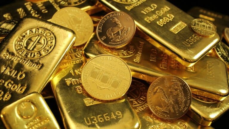 gold coins and bars in a pile