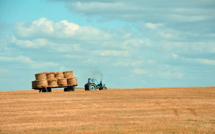 Tractor pulling hay at a farm